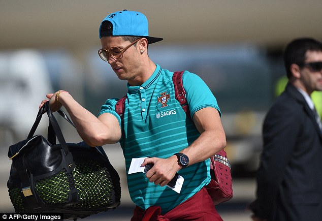 Christiano Ronaldo with man bag - Fashion Galleries - Telegraph